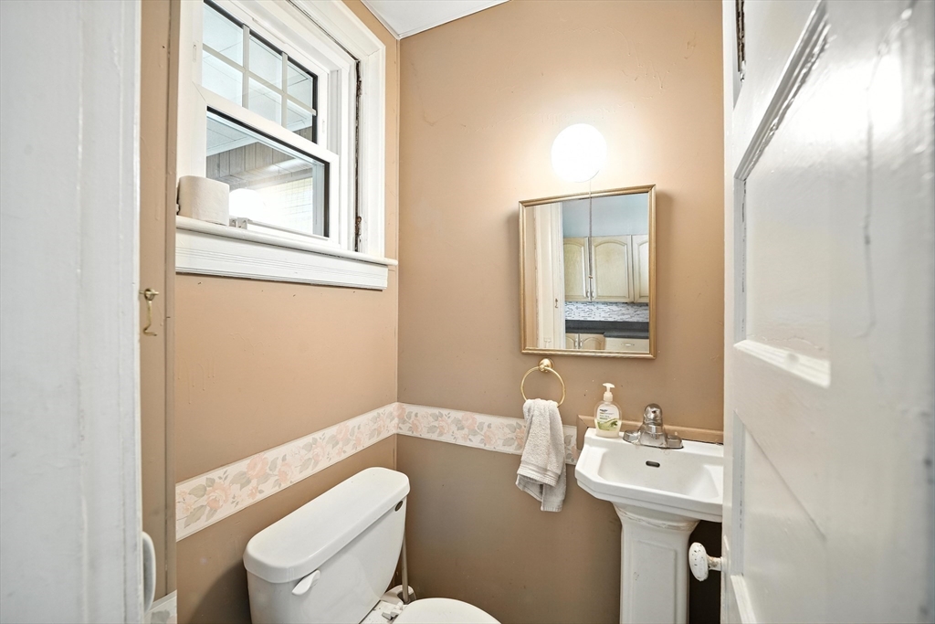 36 Maple Terrace West Springfield, MA 01089 - Photo 13 of 33 a bathroom with a toilet a sink and a mirror