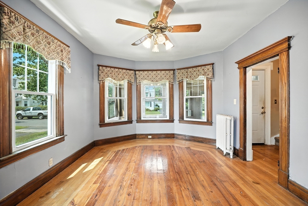 36 Maple Terrace West Springfield, MA 01089 - Photo 9 of 33 a view of an empty room with wooden floor and a window
