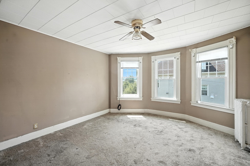 36 Maple Terrace West Springfield, MA 01089 - Photo 10 of 33 an empty room with windows and fan