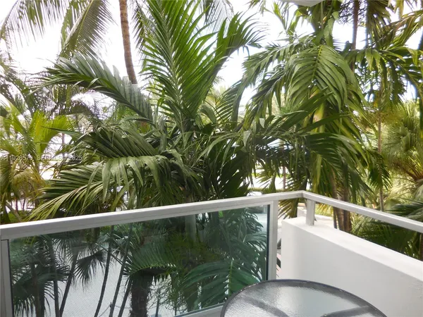 a view of a swimming pool with a yard