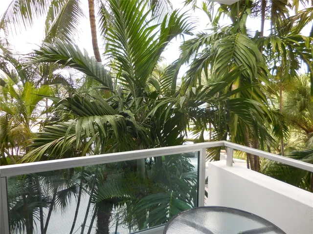 a view of a swimming pool with a yard