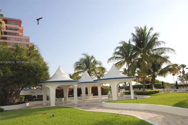 a view of outdoor space with palm trees