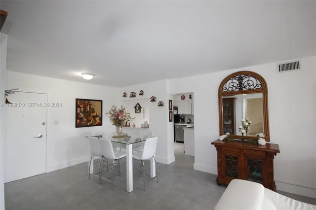 a view of a livingroom with furniture and window