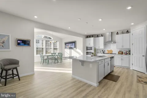 a kitchen with counter top space cabinets and stainless steel appliances