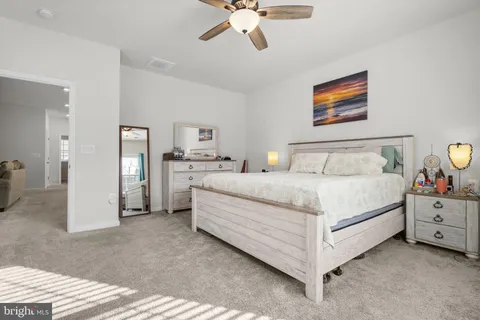 a bathroom with a tub a sink and a mirror
