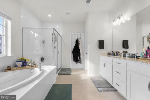 a utility room with dryer washer and a window