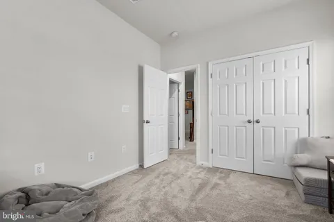 a view of a swimming pool with outdoor seating