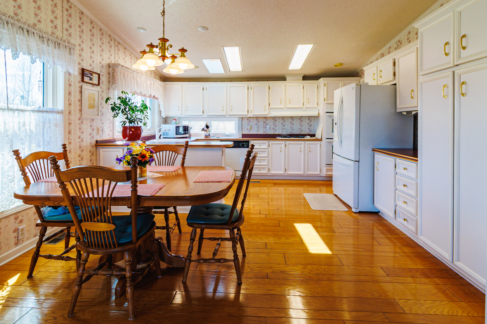 275 Tulip Circle Matteson, IL 60443 - Photo 12 of 44 a kitchen with stainless steel appliances granite countertop a dining table chairs and a refrigerator