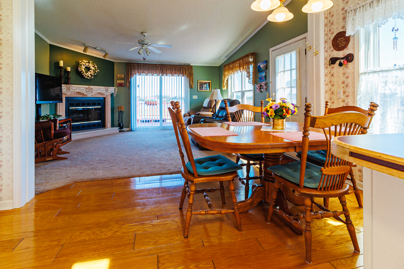 275 Tulip Circle Matteson, IL 60443 - Photo 14 of 44 a dining room with furniture a flat screen tv and a fireplace