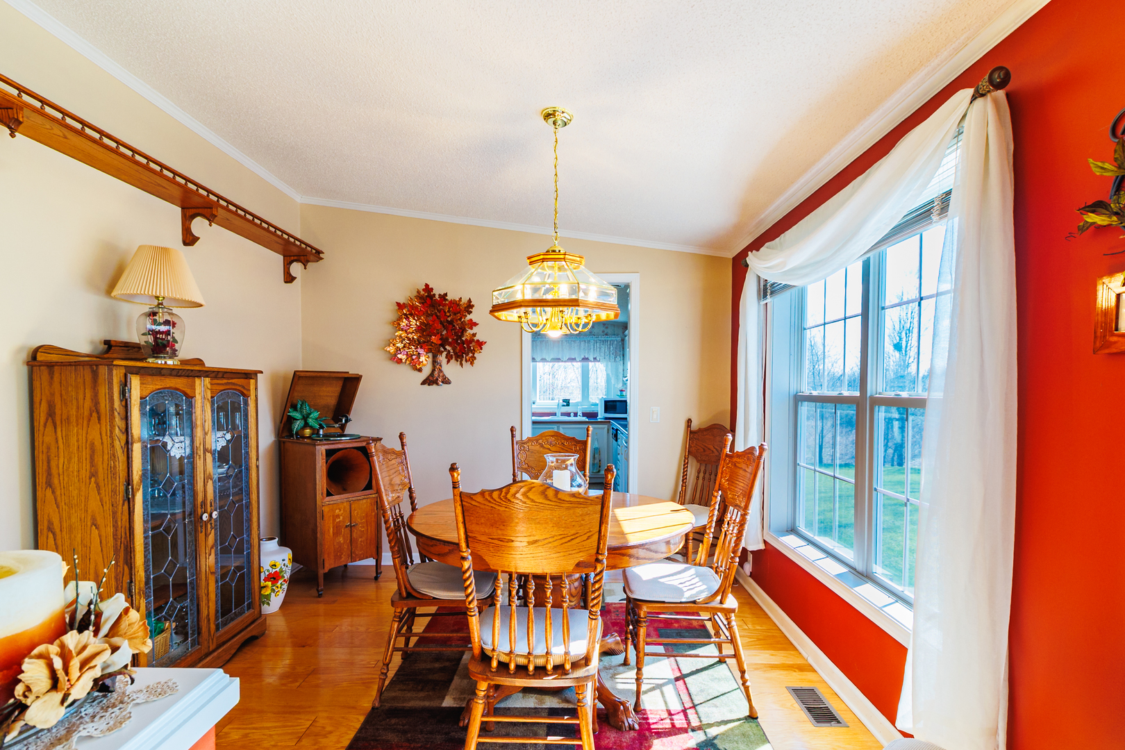 275 Tulip Circle Matteson, IL 60443 - Photo 9 of 44 a dining room with furniture a chandelier and wooden floor