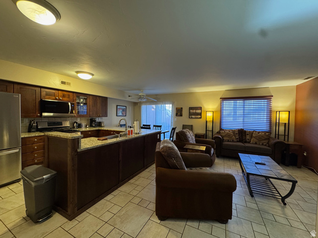 3439 Westwater Road Moab, UT 84532 - Photo 31 of 64 Living room with a ceiling fan