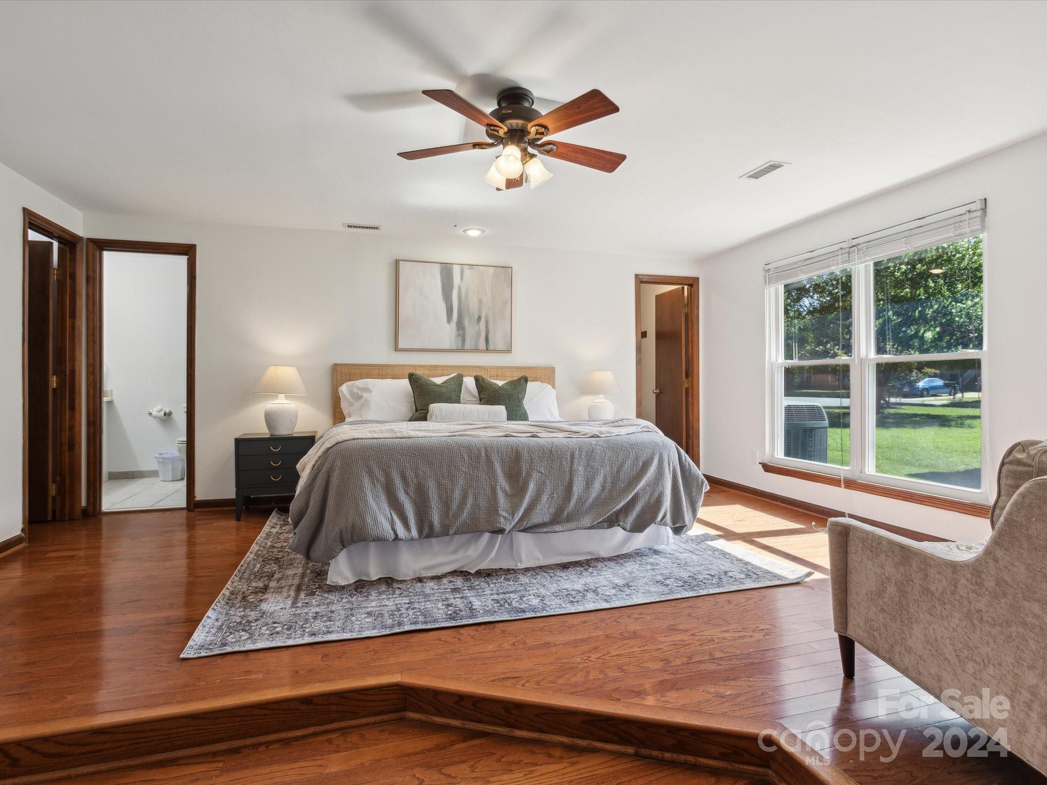 10039 Fairway Ridge Road Charlotte, NC 28277 - Photo 13 of 28 a bedroom with a large bed and a large window