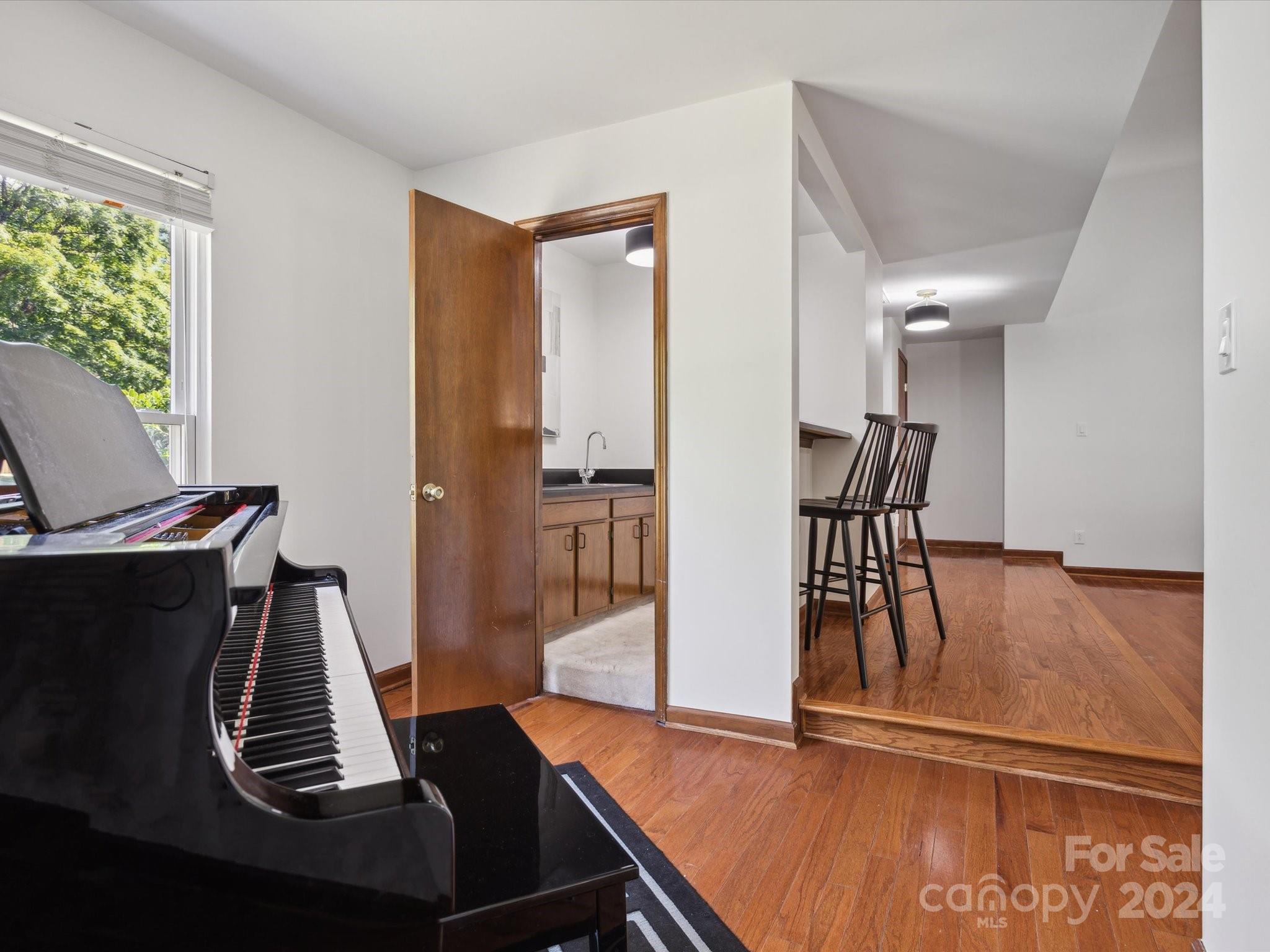 10039 Fairway Ridge Road Charlotte, NC 28277 - Photo 18 of 28 a view of a hallway with furniture and wooden floor