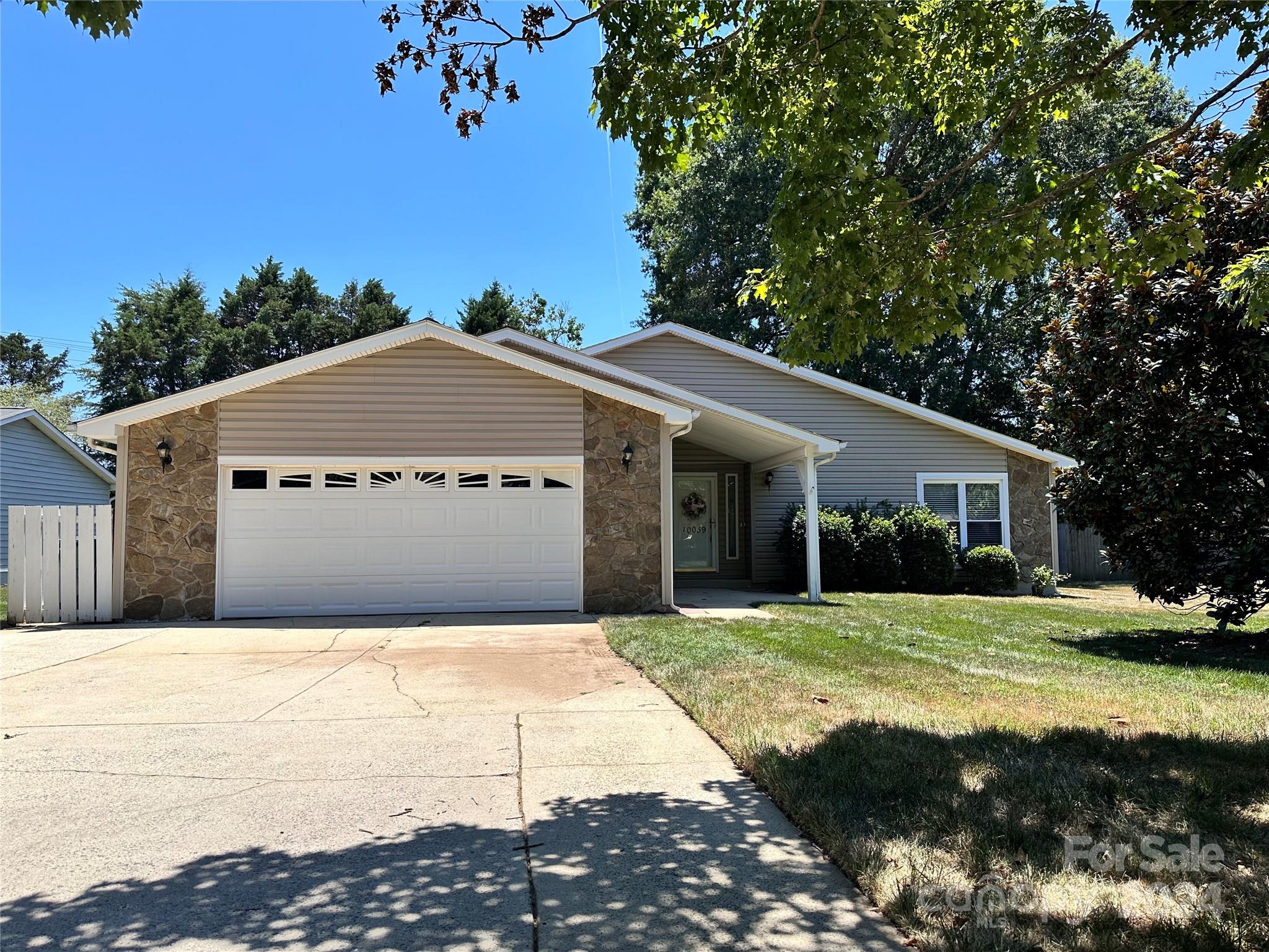 10039 Fairway Ridge Road Charlotte, NC 28277 - Photo 2 of 28 a front view of a house with a yard