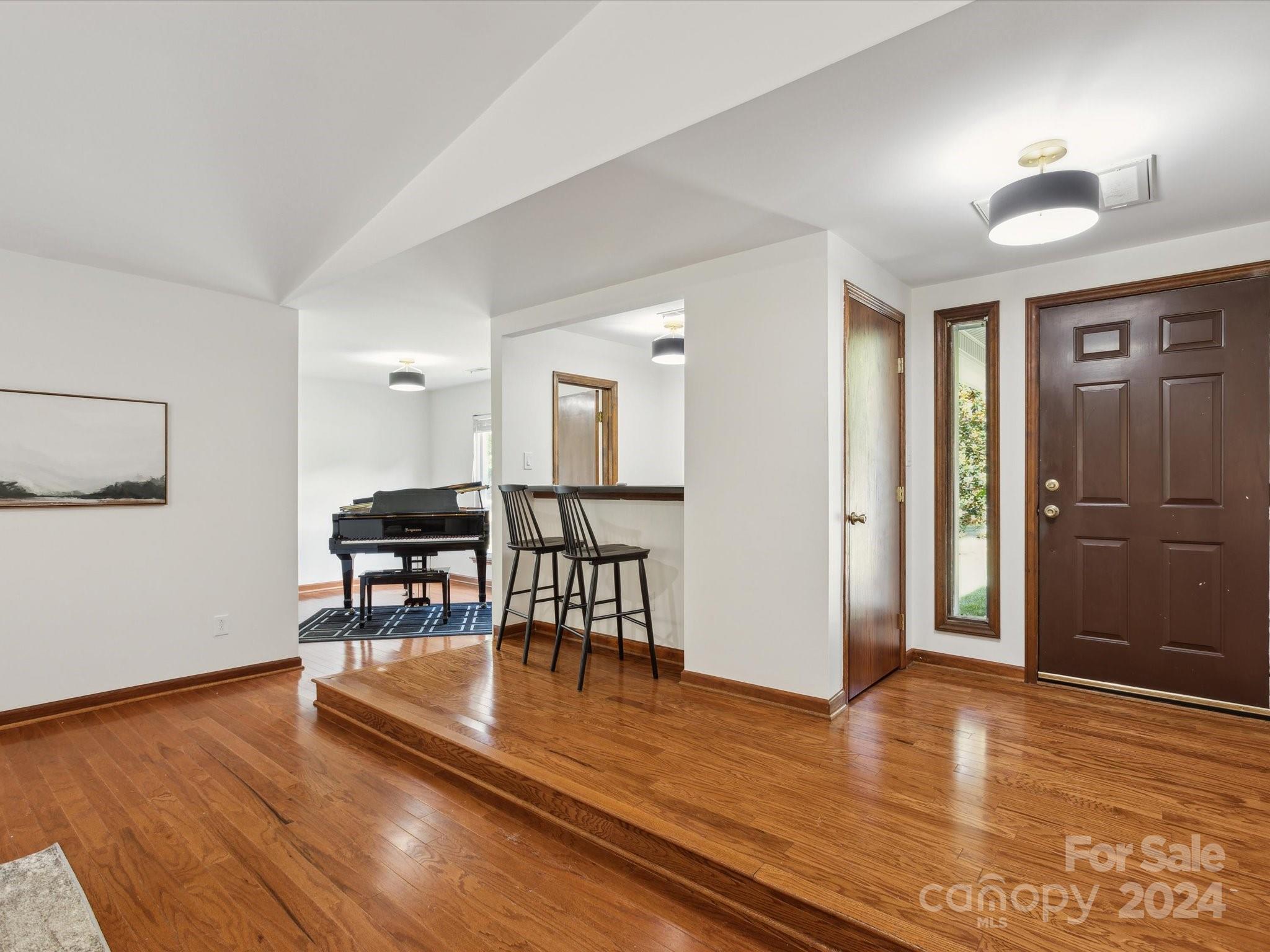10039 Fairway Ridge Road Charlotte, NC 28277 - Photo 7 of 28 a view of a livingroom with furniture and wooden floor