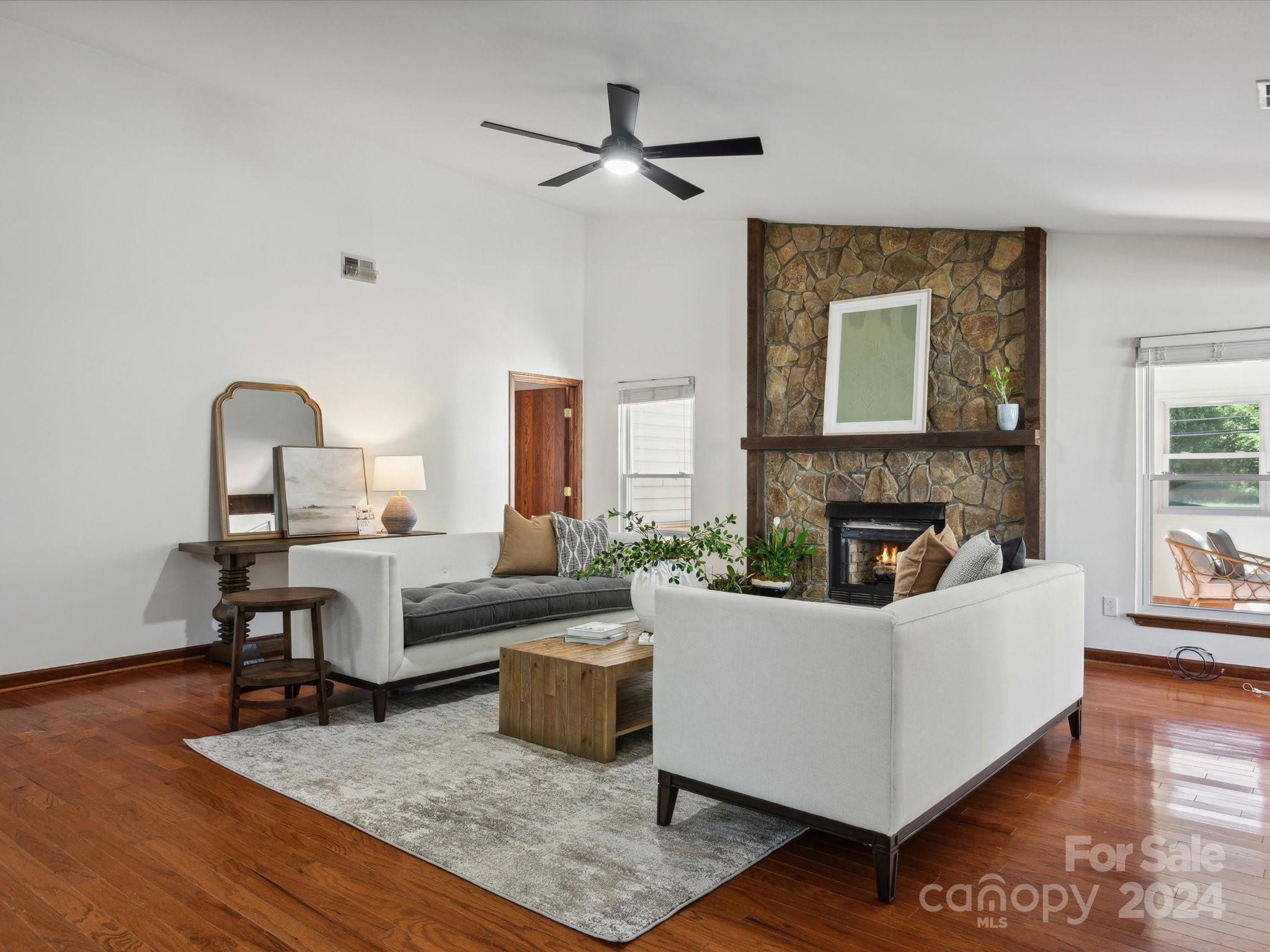 10039 Fairway Ridge Road Charlotte, NC 28277 - Photo 8 of 28 a living room with furniture and a fireplace