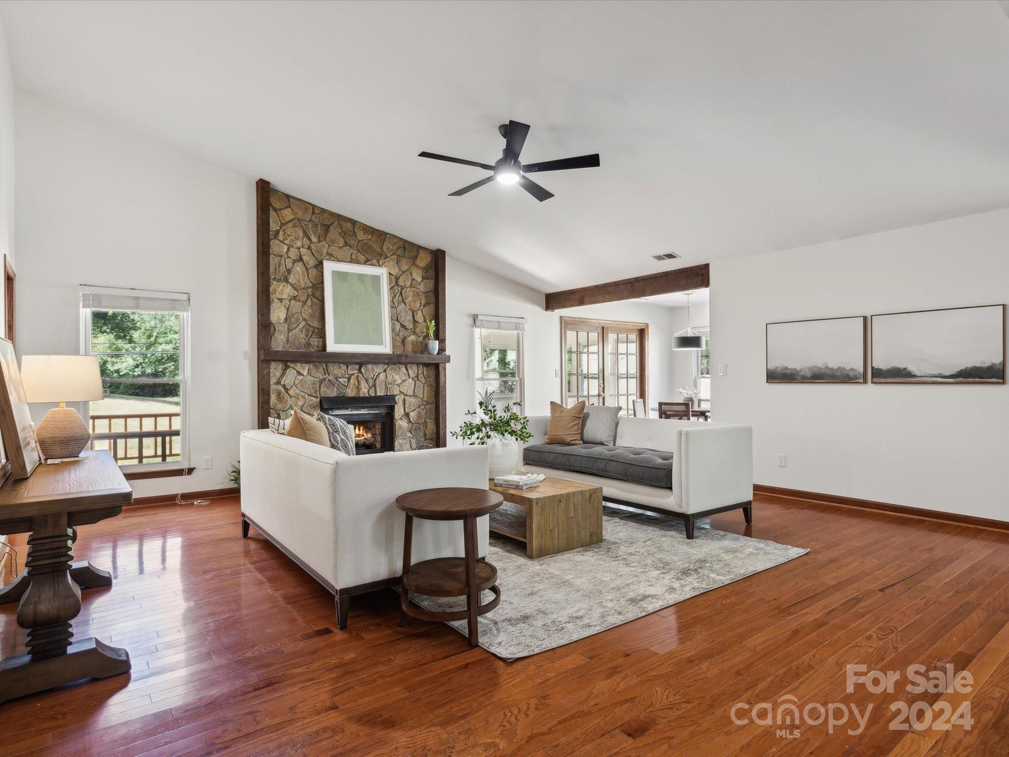 10039 Fairway Ridge Road Charlotte, NC 28277 - Photo 9 of 28 a living room with furniture and a fireplace