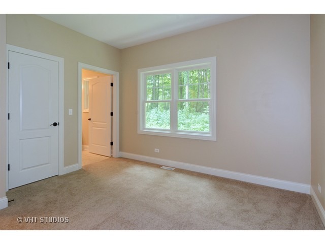 17 P Ashe Road Sugar Grove, IL 60554 - Photo 13 of 17 a view of an empty room with a window