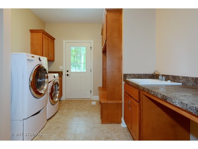 17 P Ashe Road Sugar Grove, IL 60554 - Photo 14 of 17 a utility room with sink dryer and washer