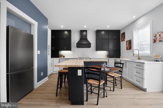 a kitchen with a stove and a microwave