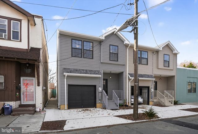 a open kitchen with stainless steel appliances granite countertop a stove and a refrigerator
