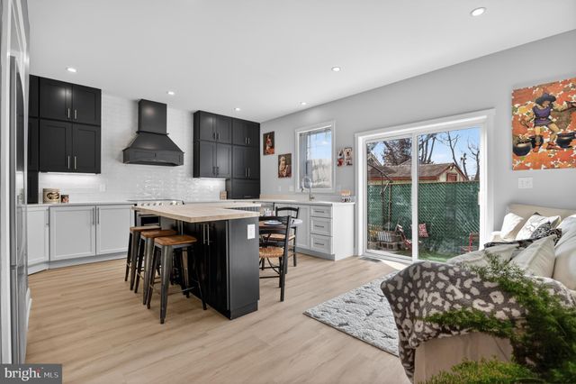 a kitchen with a table chairs and microwave