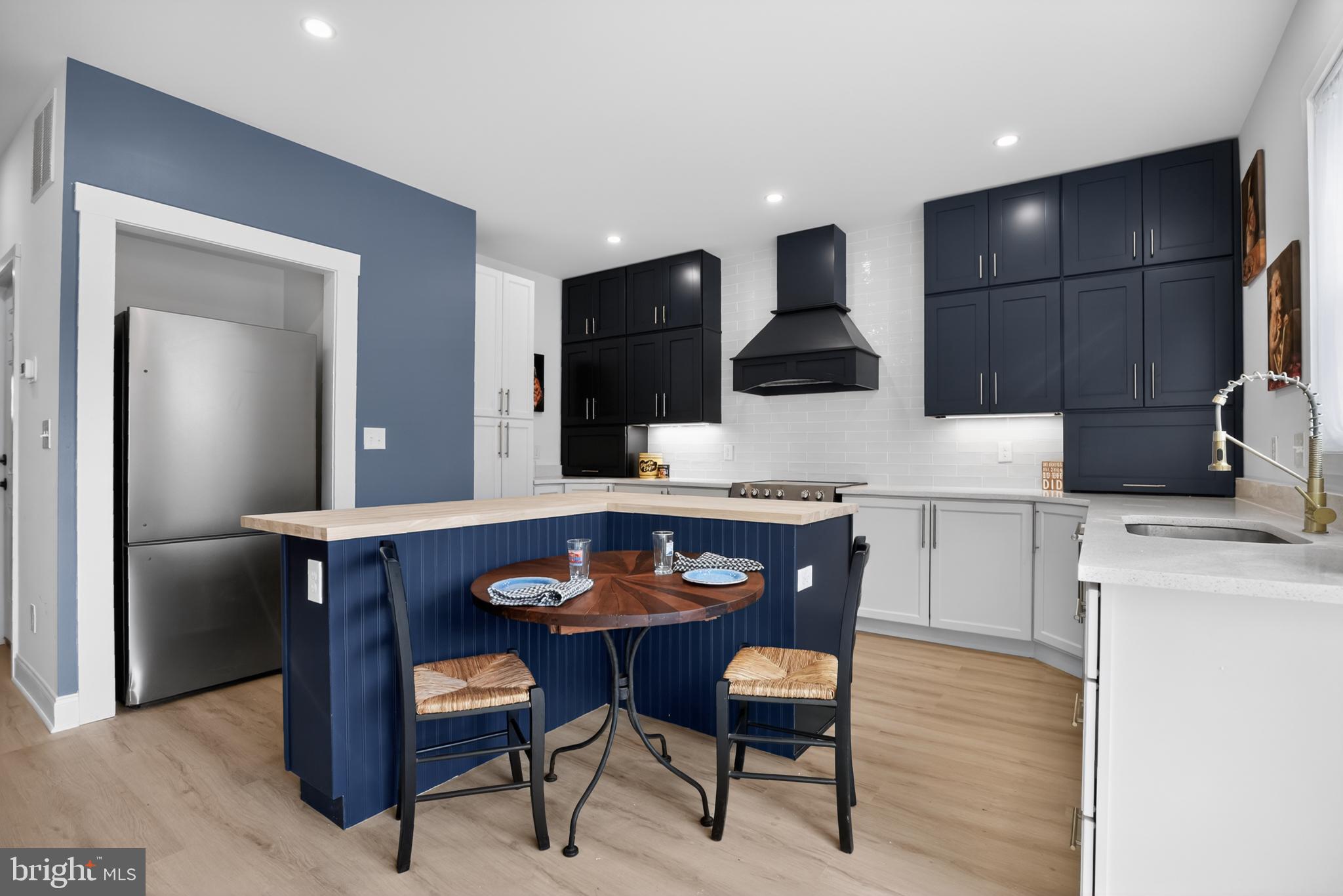 508 Richey Avenue Collingswood, NJ 08107 - Photo 6 of 40 a kitchen with a table chairs and microwave