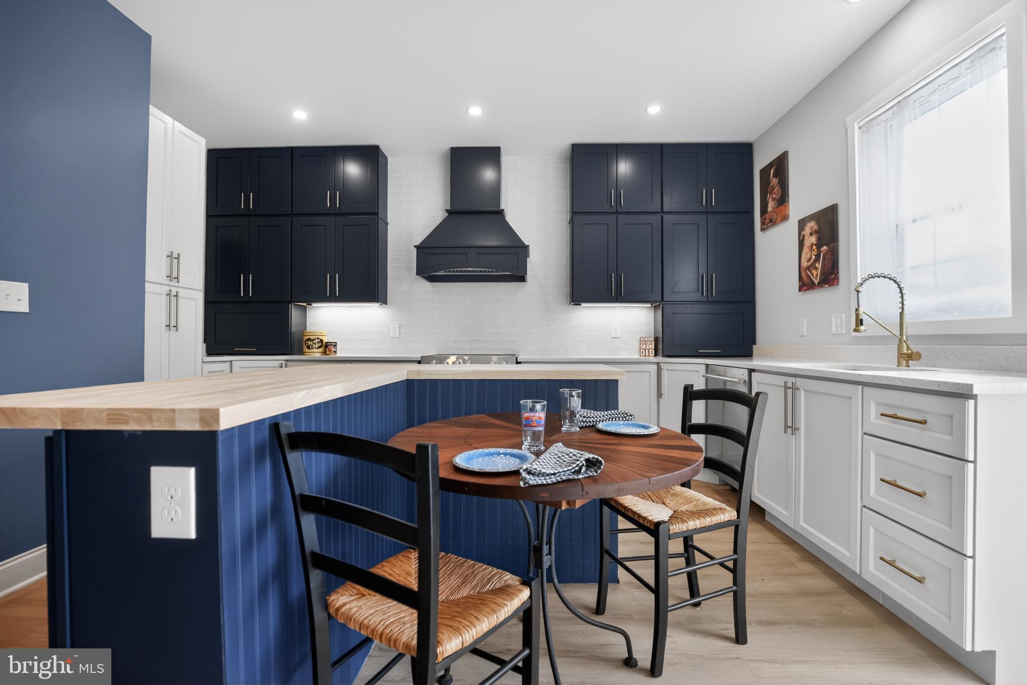 508 Richey Avenue Collingswood, NJ 08107 - Photo 8 of 40 a kitchen with a sink a table and chairs in it