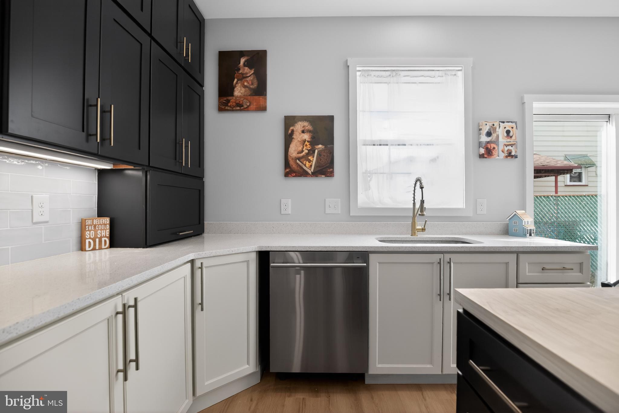 508 Richey Avenue Collingswood, NJ 08107 - Photo 9 of 40 a kitchen with stainless steel appliances white cabinets and a sink