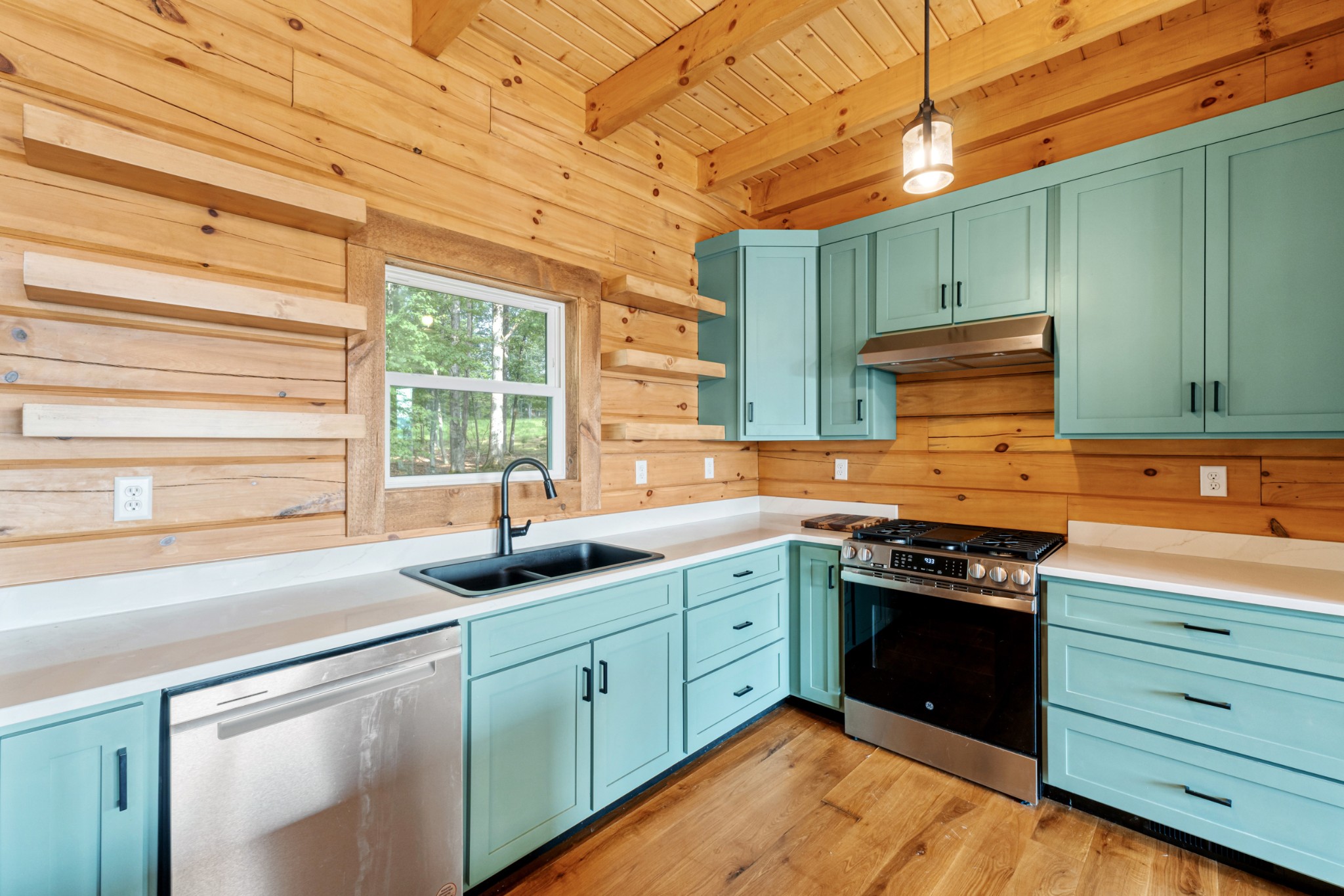 2367 Eagle Rock Road Monteagle, TN 37356 - Photo 13 of 63 a kitchen with stainless steel appliances granite countertop a sink a stove and a wooden cabinets