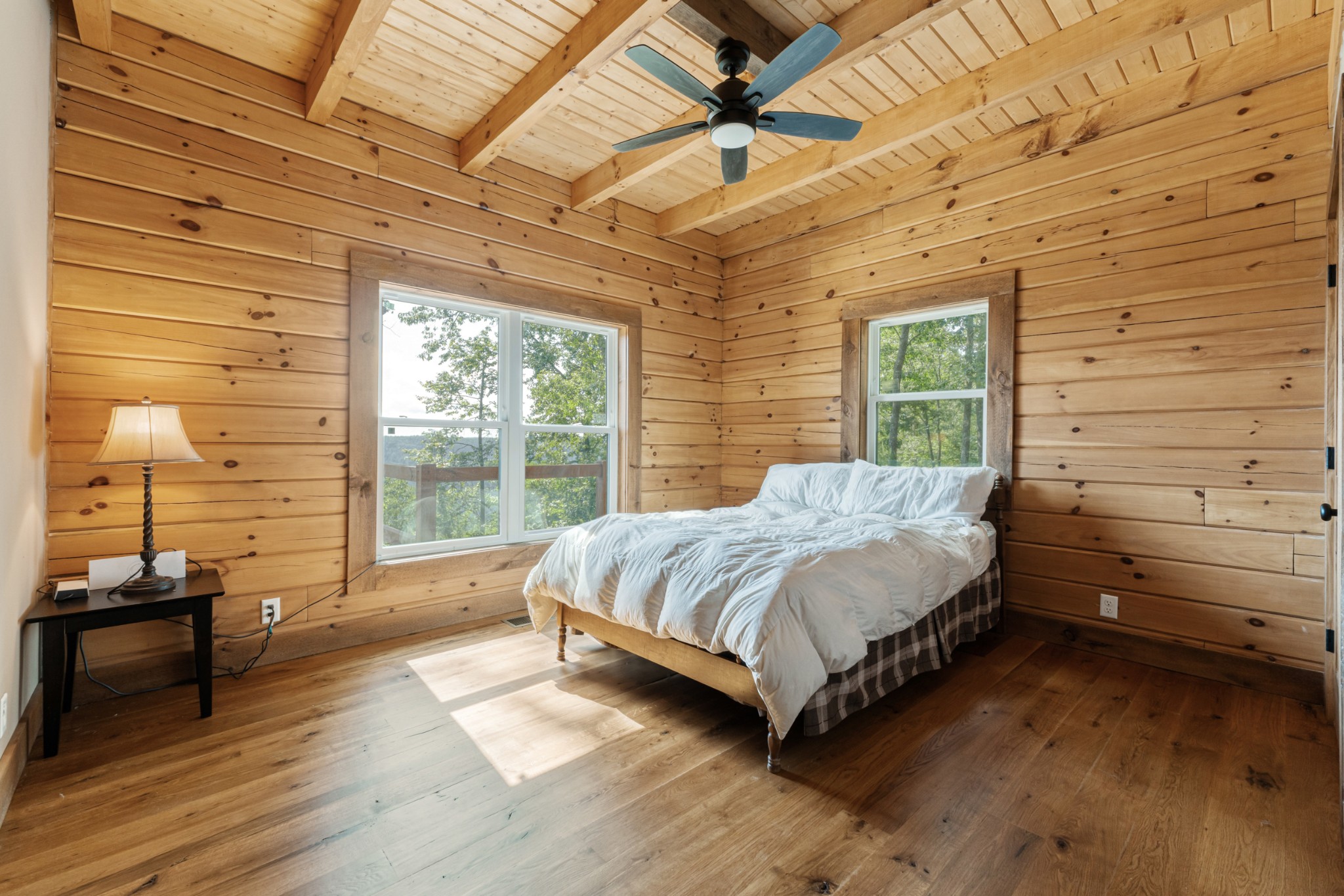 2367 Eagle Rock Road Monteagle, TN 37356 - Photo 31 of 63 a bed sitting in a bedroom next to a window