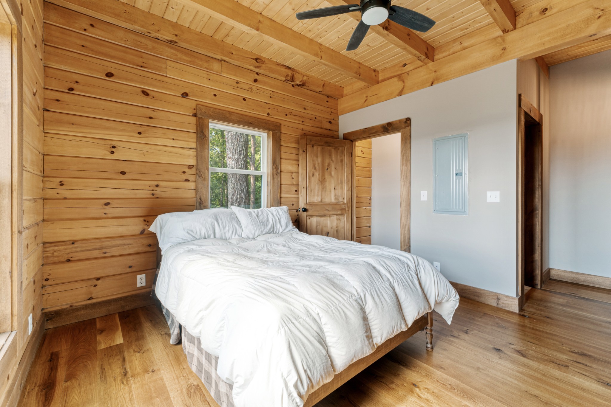 2367 Eagle Rock Road Monteagle, TN 37356 - Photo 32 of 63 a bedroom with a bed and a wooden floor