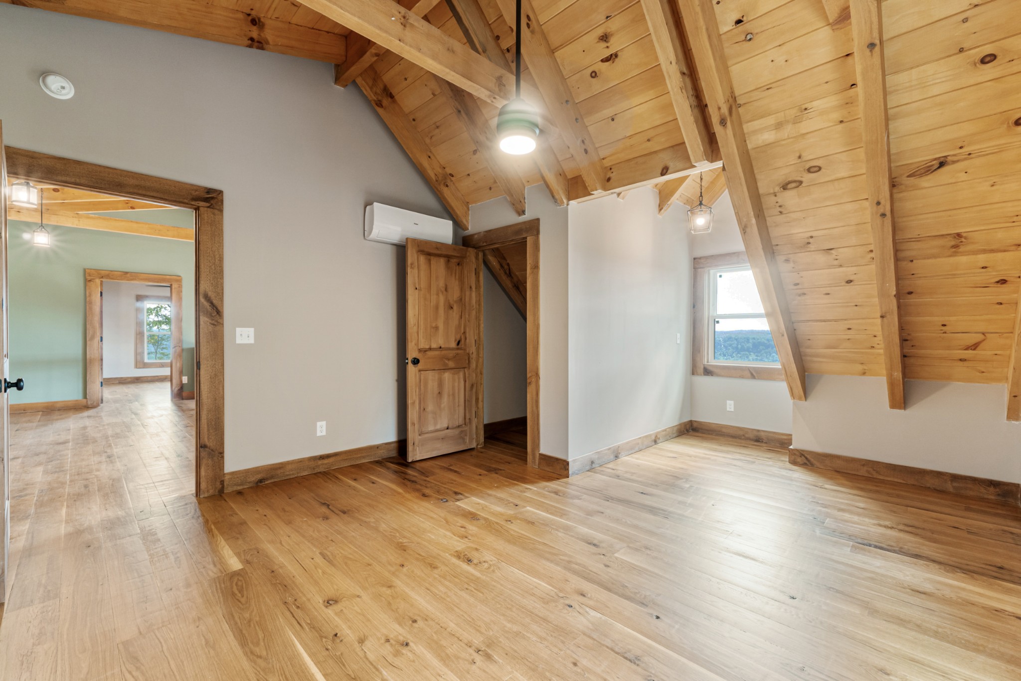 2367 Eagle Rock Road Monteagle, TN 37356 - Photo 39 of 63 an empty room with wooden floor and windows