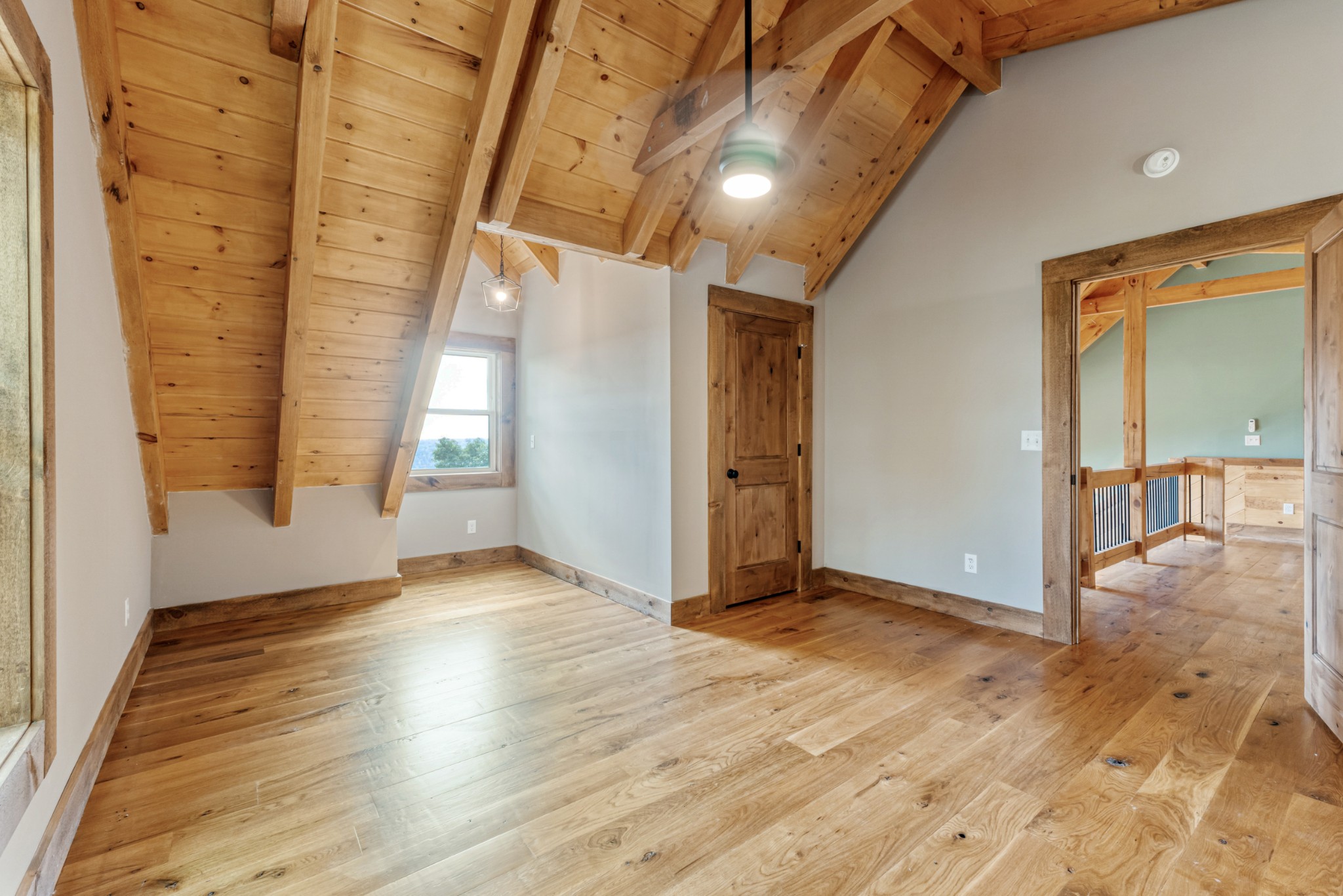 2367 Eagle Rock Road Monteagle, TN 37356 - Photo 45 of 63 an empty room with wooden floor and windows