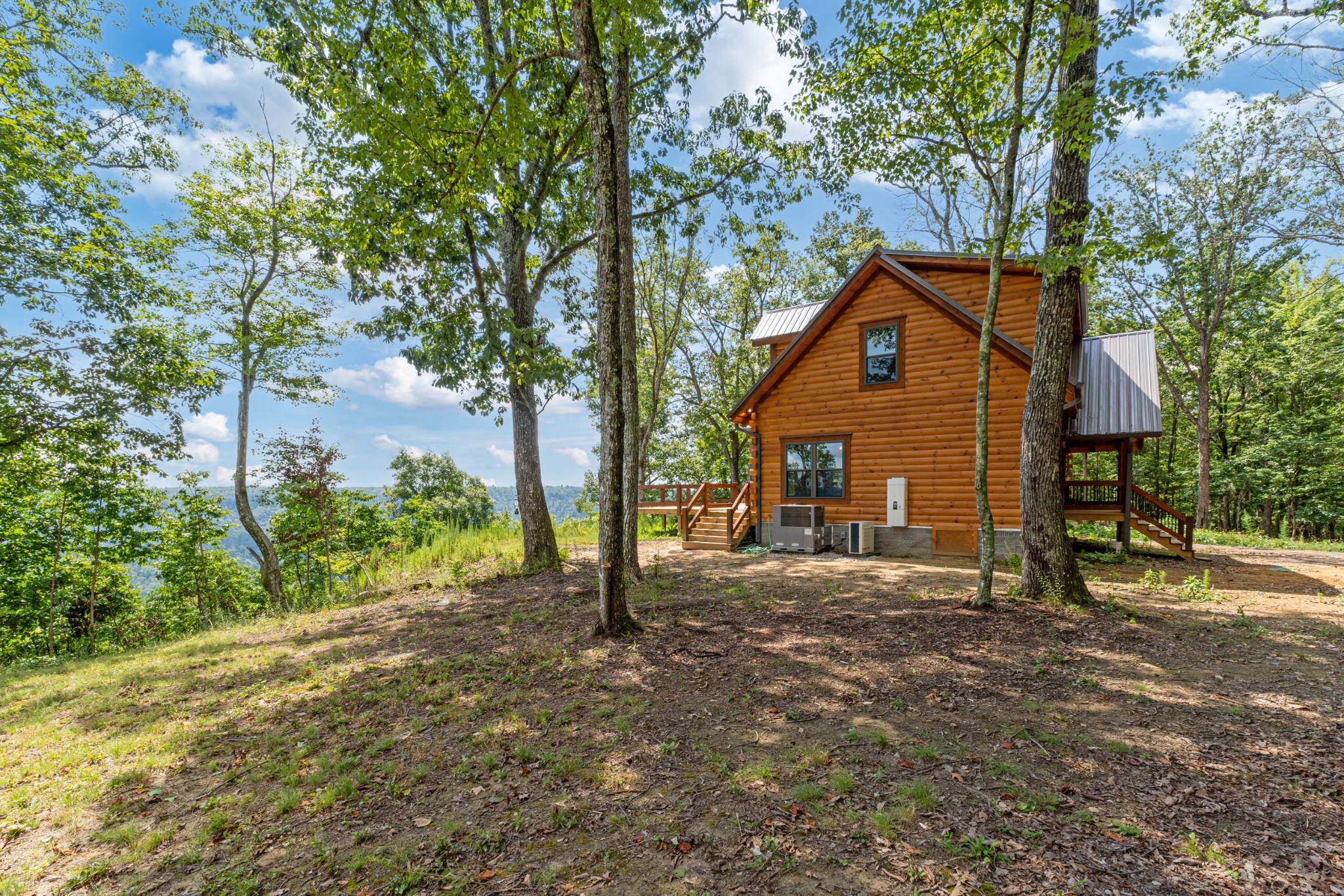 2367 Eagle Rock Road Monteagle, TN 37356 - Photo 51 of 63 a front view of a house with a yard and garage
