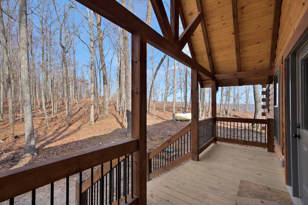 2367 Eagle Rock Road Monteagle, TN 37356 - Photo 8 of 63 a view of a porch with wooden floor and stairs