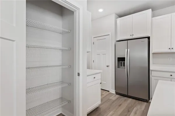 a kitchen with cabinets and stainless steel appliances