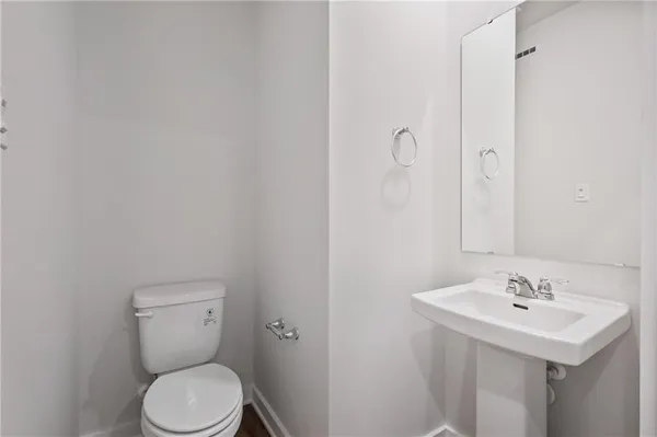 a bathroom with a sink toilet and vanity