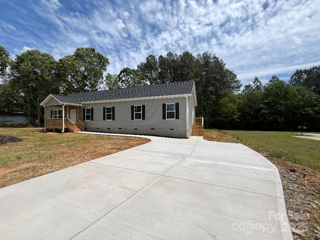 2070 Travis Road Conover, NC 28613 - Photo 1 of 8 a house with yard in front of it