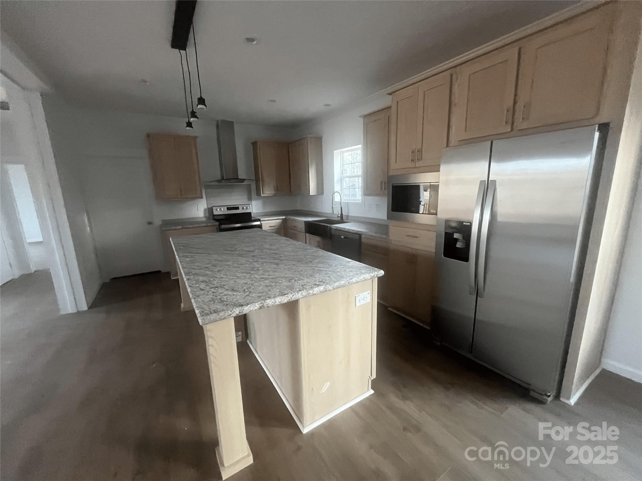 2070 Travis Road Conover, NC 28613 - Photo 4 of 8 a kitchen with kitchen island a counter top space a sink stainless steel appliances and cabinets