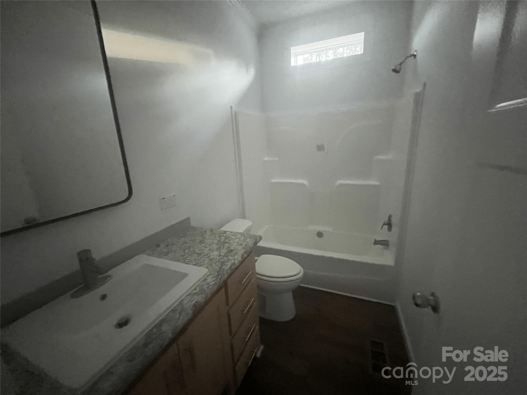 2070 Travis Road Conover, NC 28613 - Photo 7 of 8 a bathroom with a sink a toilet and shower