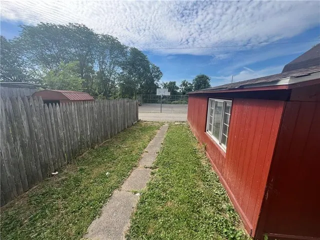 a backyard of a house with lots of green space