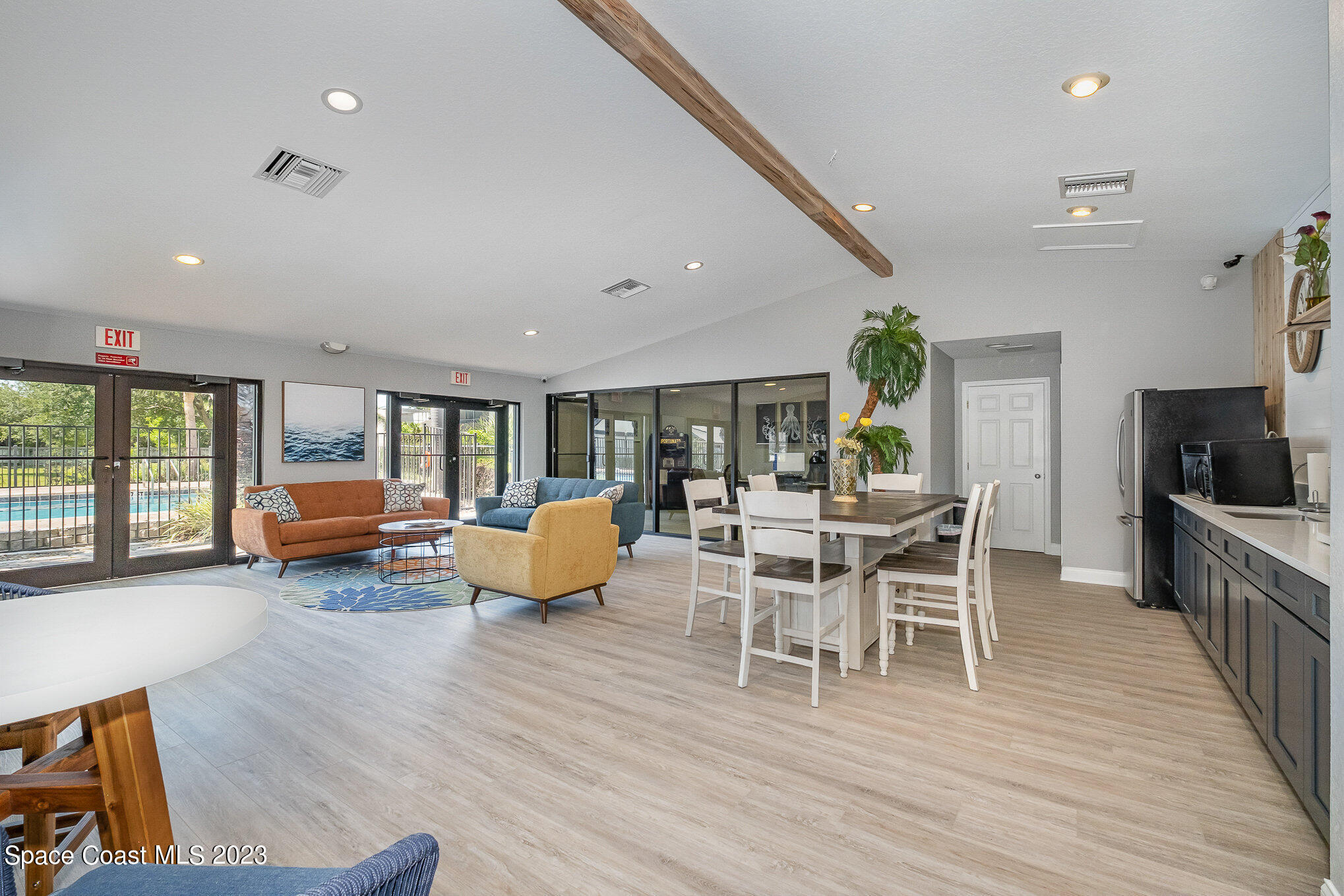 1041 June Drive Melbourne, FL 32935 - Photo 14 of 15 a dining room with wooden floor and furniture