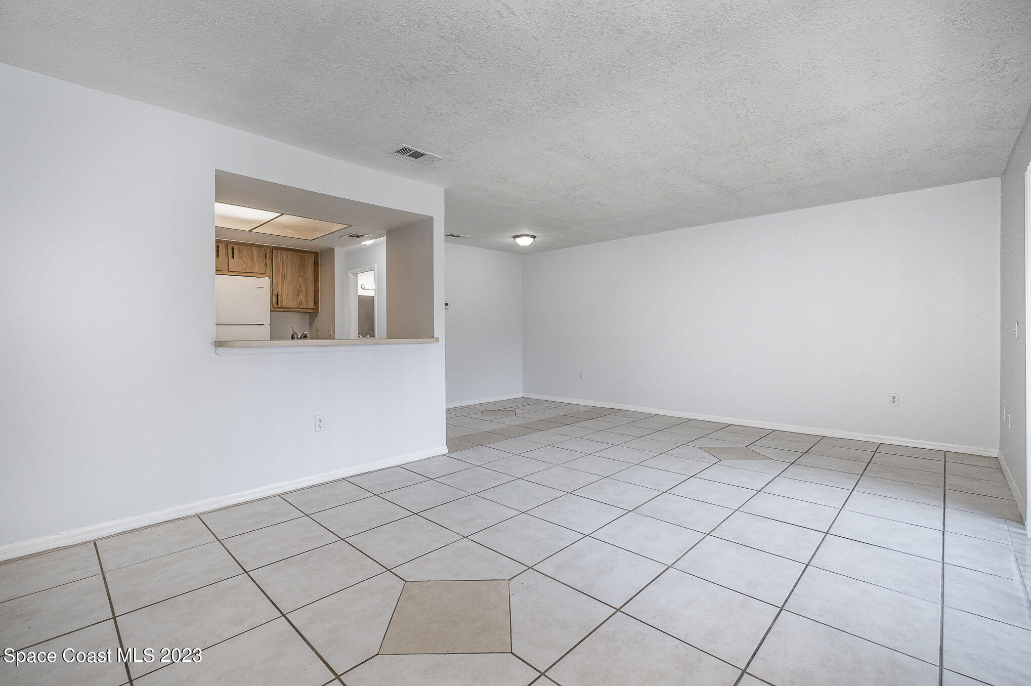 1041 June Drive Melbourne, FL 32935 - Photo 5 of 15 a view of an empty room and window