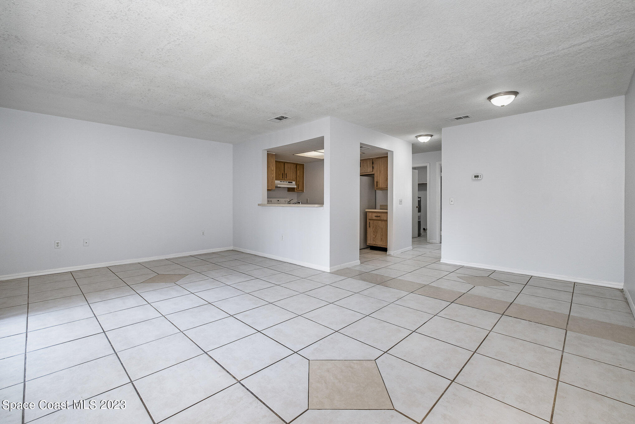 1041 June Drive Melbourne, FL 32935 - Photo 6 of 15 a view of an empty room and window