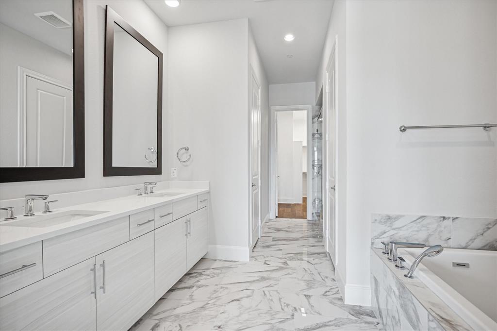 4122 Belt Line Road Addison, TX 75001 - Photo 13 of 36 a spacious bathroom with a double vanity sink mirror and double