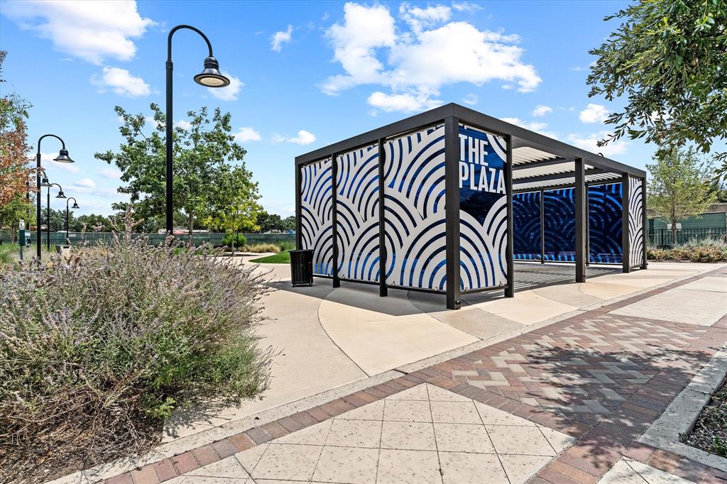 4122 Belt Line Road Addison, TX 75001 - Photo 18 of 36 a front view of a house with garden