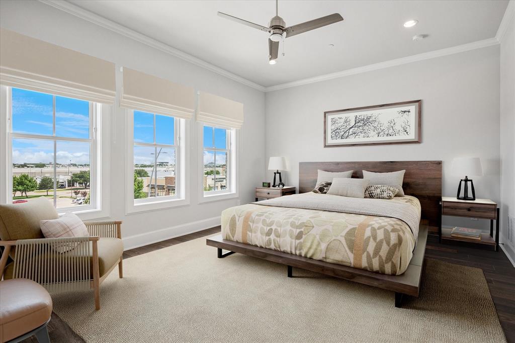 4122 Belt Line Road Addison, TX 75001 - Photo 4 of 36 a spacious bedroom with a bed and a couch