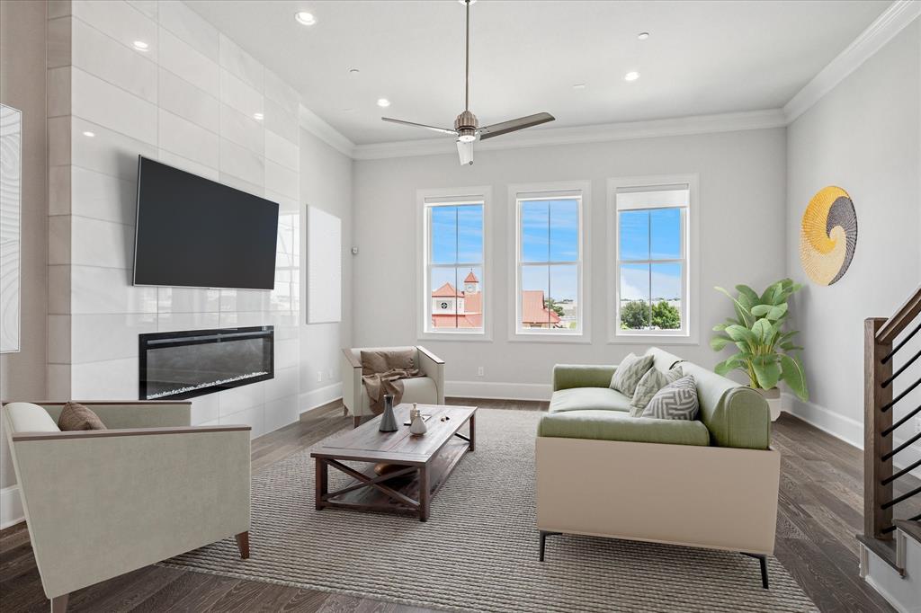 4122 Belt Line Road Addison, TX 75001 - Photo 6 of 36 a living room with furniture a fireplace and a flat screen tv