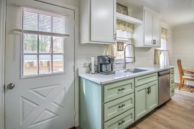 a white refrigerator freezer sitting inside of a kitchen